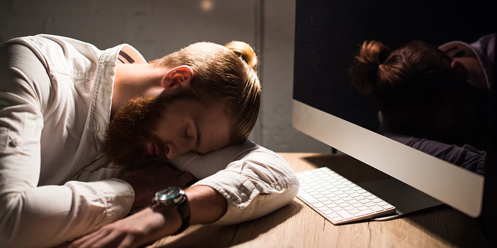 man asleep after looking at a website